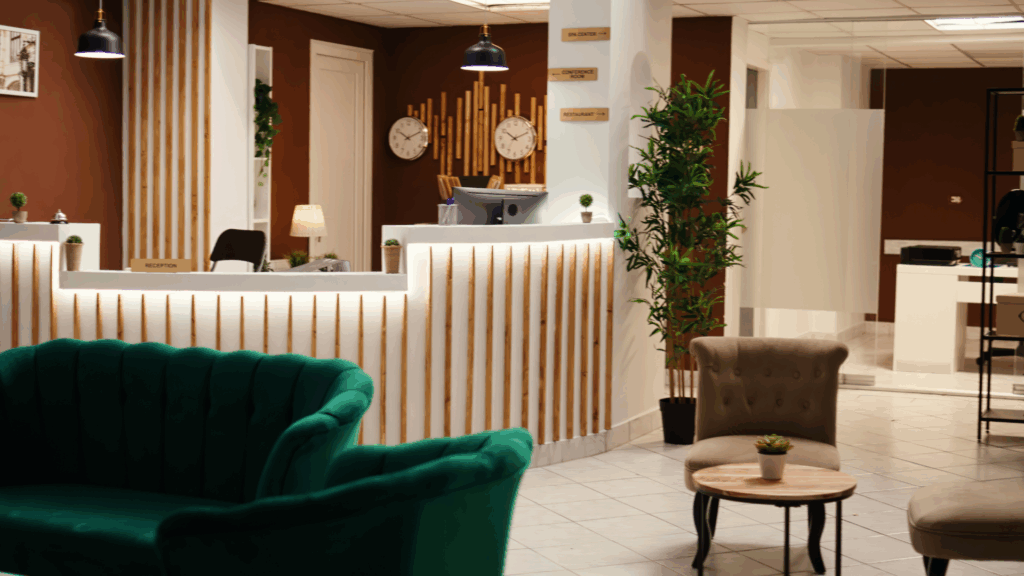 wide-angle-shot-travel-accommodation-hotel-lounge-with-check-reception-desk-stylish-empty-modern-resort-foyer-interior-with-cozy-furniture-warm-fireplace-ready-welcome-tourists